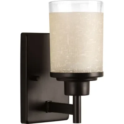Create the sophisticated feel of modern, urban living in your home with this one-light bath fixture from the Alexa Collection. Visually interesting etched umber linen finished glas...