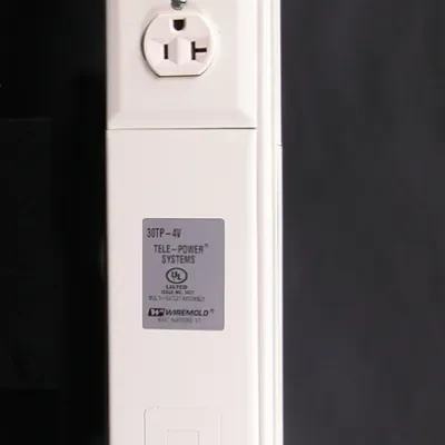 Two-compartment pole (one power, one communication with cross over below power devices). Nominal material thickness .040" (1.0mm). Length 10'5" (3.2m). Two 20A 125V duplex receptac...