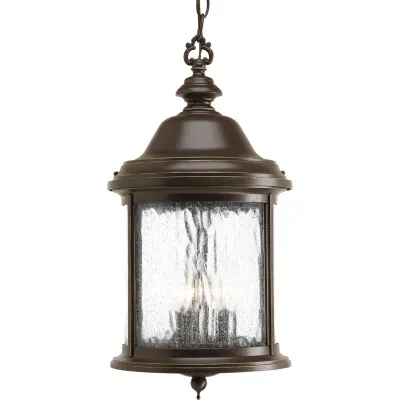 Inspired by lanterns from the Old World, the Ashmore collection incorporates handsome details, quill-scrolled arms and decorative finials. The water seeded glass is in a die-cast a...
