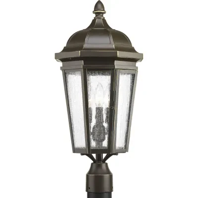 The three-light post lantern in the Verdae collection offers traditional styling for a variety of exteriors. Classic and formal clear seeded glass complements an Antique Bronze fin...